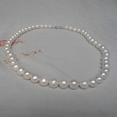 Description jewelry: pearl necklace pearl colour: white Pearl Diameter: 7-8mm Pearl category: real Feshwater pearl Pearl Body: with tiny blemish or ring Pearl grade: AA+ Pearl Luster: high Pearl Shape: suborbicular ( as shown) Necklace length: select Clasp: lobster clasp, The pearls are individually hand knotted . Packing: Beautiful Pouch Click on the image(s) for larger view Matching 2 layer necklace: https://www.etsy.com/listing/873982806/white-pearl-necklace7-8mm-freshwater?ref=shop_home_feat Classic Pearl Necklace With Round Beads, Classic Pearl Necklace With Round Beads As Gift, Classic Pearl Necklace As A Gift, Classic Pearl Necklace Gift, Pearl Necklace With Round Beads And Pearl Charm, Akoya Pearl Necklace With Round Beads And Pearl Charm, Pearl Necklaces With 8mm Beads For Gifts, White Pearl Necklace As A Gift, Classic Pearl White Pearl Necklace As Gift