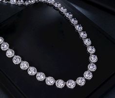 A beautiful two-piece bridal jewelry set with an incredible sparkle! Adorned with intricately faceted cubic zirconia that capture the light from every angle with a perfectly translucent appeal, the pieces are platinum plated for a flawless finish which enhances the intricate detailing and conveys a modern take on old elegance. Necklace: 16" (approx. 40.6cm) long with a secure fold-over closure (a 2" extension can be added if a longer length is needed, please leave a note with your order at check Formal Crystal Bridal Sets With Brilliant Cut, Formal Bridal Sets With Brilliant Cut Crystals, Diamond White Cubic Zirconia Bridal Necklace With Prong Setting, Diamond White Cubic Zirconia Bridal Sets For Formal Occasions, Formal Diamond White Cubic Zirconia Bridal Sets, Diamond White Bridal Necklace With Prong Setting, Formal Bridal Sets With Diamond Cut Cubic Zirconia, Dazzling Cubic Zirconia Bridal Necklace With Prong Setting, Diamond White Crystal Bridal Necklace With Prong Setting