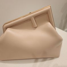 Brand New Fendi Handbag/Shoulder Bag In Warm Beige/Cream Color With Slight Pinkish Tone. Pure Leather With Gold Metal. It's Brand New With Its Handle And Belt Still In Its Package. Come With Dust Bag Of Course. Luxury Beige Clutch For Shopping, Beige Crossbody Evening Bag For Shopping, Classic Beige Clutch Bag, Designer Beige Clutch With Detachable Strap, Modern Beige Pouch Evening Bag, Modern Beige Clutch With Detachable Handle, Beige Shoulder Bag Pouch For Shopping, Modern Beige Clutch For Shopping, Modern Beige Satchel Clutch