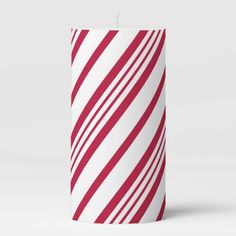 a red and white striped candle is shown