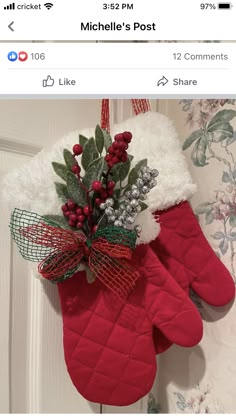 an oven mitt with holly and berries hanging from it