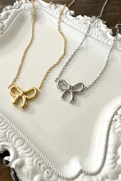 Get ready to amp up your style with our adorable Dainty Bow Necklace! Wrap yourself in charm and sweet simplicity with this gorgeous necklace featuring a tiny bow pendant. Timeless Design: The delicate bow design adds a timeless and feminine touch to your style. High-Quality Stainless Steel: Crafted with precision and durability in mind, our necklace is made from high-quality stainless steel, ensuring longevity and resistance to tarnish. Versatile Finishes: Choose between the classic elegance of Bow Pendant, Tiny Bow, Bow Necklace, Bow Design, Nail Wraps, Gorgeous Necklaces, Classic Elegance, Gift Christmas, Gift Birthday