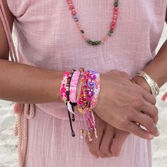 Friendship Never Goes Out of Style—Just Ask Taylor Swift! Good friends make life colorful, and what better way to celebrate that than with our Bali Friendship Bracelets? Inspired by Taylor Swift’s love for friendship bracelets, these beaded, hand-woven pieces are perfect for your bestie or your entire tribe. Stack them for a bolder look! Made by fair-trade female artisans in Bali, these bracelets feature an adjustable pull-tie closure and a brass Love Is Project tag. Buy one or bundle up for the Beaded Wrap Bracelet As Gift, Adjustable Handwoven Braided Bracelets, Adjustable Handwoven Bracelets, Handwoven Beaded Bracelets With Round Beads, Trendy Hand-strung Friendship Bracelets For Festivals, Trendy Festival Hand-strung Friendship Bracelets, Colorful Festival Bracelets, Multicolor Braided Bracelets With Colorful Beads For Summer, Adjustable Pink Woven Jewelry