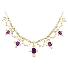 A stunning antique Edwardian 4.47 carat amethyst and seed pearl, 15 karat yellow gold necklace; part of our diverse antique jewellery and estate jewelry collections. This stunning, fine and impressive antique Edwardian amethyst necklace has been crafted in 15k yellow gold. The feature setting is ornamented with five floriated drop settings, each displaying a collet set emerald cut amethyst, totalling 4.47cts. Each amethyst setting incorporates three protruding collet set pearls, in addition to a Purple Closet, Regency Jewelry, Edwardian Necklace, Seed Necklace, Amethyst Set, Multicolor Jewelry, Edwardian Jewelry, Jewellery Vintage, Diamond Necklace Set