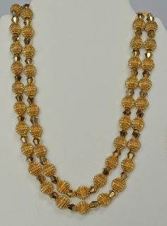 Alfred Philippe was Crown Trifari's Chief Designer from 1930 until 1968.  This exquisite necklace and earrings set was introduced during that time period and became referred to simply as the "Electra Collection".  The collection pieces utilized two innovative and striking types of beads.  The first type was the so called "Trifanium" spiked bead.  The second type was a gold plated crystal called an "Autrum" bead.  The intent of the Electra design was simply to "blow away" the competition--which i Classic Gold Necklaces With Matching Earrings, Classic Gold Necklace With Matching Earrings, Classic Gold Jewelry Sets For Celebration, Vintage Gold Jewelry With Polished Beads, Vintage Gold Necklaces With Matching Earrings, High Luster Round Bead Jewelry For Weddings, High Luster Round Beads Jewelry For Wedding, Vintage Gold Necklace With Matching Earrings, Gold Plated Round Beads Jewelry For Formal Events