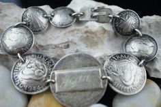 This is the perfect option for those who like cool, unique jewelry and the luxury, shine of silver. The bracelet is made of Australia coins that are linked together. The coins have different size. The middle has been engraved:New.... Gean Brother. The length of the bracelet is about 7.5 inches. The weight is 32g. The age is circa 1940s-1950s. ♥ There is no hallmark, but It is sterling 925(tested with acid). Everyone interested in the jewelry should remember that they must like their bracelet - n Antique Engraved Silver Bracelets, Antique Silver Bracelet Gift, Engraved Sterling Silver Antique Bracelet, Antique Silver Engraved Sterling Silver Bracelet Gift, Engraved Antique Silver Sterling Bracelet Gift, Heirloom Silver Jewelry For Commemoration, Antique Silver Engraved Bracelets For Anniversary, Antique Silver Engraved Bracelets, Antique Engraved Sterling Silver Bracelets