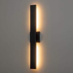 a wall mounted light that is on the side of a wall with a white background