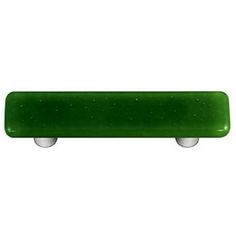 a green skateboard sitting on top of a white wall