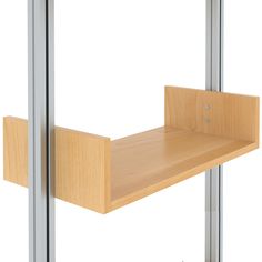 a wooden shelf sitting next to a glass door