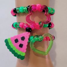 These kandi bracelets are made with glitter pink,green and black pony beads and cute charms. These are made in all different sizes. One size fits most. Perfect for any event! You will get lots of compliments in this unique wearable art! Stand out at your next event! Edm festival  Raves Party  Rave outfit  Festival outfit Pride Party favors  Birthday gifts Stocking stuffer  Rave anniversary  Rave gift Fun Green Beaded Bracelets, Fun Green Beaded Bracelets With Round Beads, Handmade Green Heart-shaped Bracelet, Playful Green Stretch Bracelet As Gift, Fun Green Bracelets With Round Beads, Fun Green Beaded Stretch Bracelet, Fun Green Round Beaded Bracelets, Green Beaded Fun Stretch Bracelet, Green Beaded Stretch Bracelet Fun Style