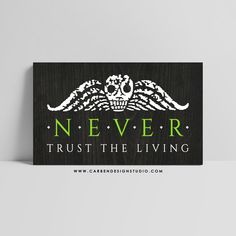 a wooden sign that says never trust the living