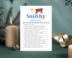 a nativity trivia with candles next to it