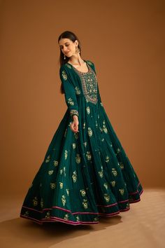 Editor's Note Featuring a zardozi embroidered brocade anarkali with flat chiffon dupatta and trousers Color: Bottle green Fabric: Viscose brocade, cotton satin, flat chiffon Embroidery details: Applique, gota and thread embroidery Anarkali length: 57", trouser length: 38" Components: Anarkali, trouser & dupatta Occasion: Festive Care: Dry clean only About the Designer Shyam Narayan Prasad started his journey in the Indian Fashion Design Industry with a couture women’s wear collection. The design Designer Green Cotton Silk Anarkali Set, Anarkali Set With Intricate Embroidery, Anarkali Palazzo Set With Resham Embroidery For Festivals, Green Cotton Silk Lehenga For Eid, Green Anarkali Cotton Silk Palazzo Set, Anarkali Churidar With Intricate Embroidery, Bollywood Style Anarkali Set In Chinon, Anarkali Set With Intricate Embroidery And Straight Kurta, Navratri Silk Anarkali Set With Dabka Details