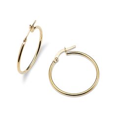 These hoop earrings feature a classic look with a slim  rounded profile and a lightweight feel  making them perfect for daily wear. A latch back keeps these beautiful 14-karat yellow gold hoops secure. Classic Huggie Earrings With Lever Back For Everyday, Classic Everyday Huggie Earrings With Lever Back, Classic 14k Gold Earrings For Everyday, Everyday Classic Yellow Gold Earrings, Classic Everyday Yellow Gold Earrings, Yellow Gold Polished Hoop Earrings For Everyday, Everyday Yellow Gold Polished Hoop Earrings, Everyday Polished Yellow Gold Hoop Earrings, Classic Hypoallergenic 14k Gold Earrings