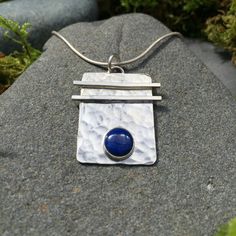 "Sterling silver with a 6mm gemstone of your choice. This stunning hand-hammered pendant is 13/16\" in width by 1\" in length. A perfect complement to the Asian Flair Earrings on the earrings page. When checking out please specify if you would like a 16\" or 18\" sterling silver chain." Silver Hammered Rectangular Pendant Jewelry, Hammered Sterling Silver Rectangular Pendant Jewelry, Sterling Silver Hammered Rectangular Pendant Jewelry, Sterling Silver Rectangular Pendant With Polished Finish, Hammered Sterling Silver Jewelry With Rectangular Pendant, Hand Forged Square Pendant In Sterling Silver, Hammered Rectangular Sterling Silver Jewelry, Hammered Sterling Silver Jewelry In Rectangular Shape, Rectangular Hammered Sterling Silver Jewelry