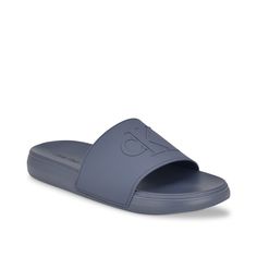 Calvin Klein-Wiston Slide Sandal Chill by the pool in style wearing the Wiston slide sandal from Calvin Klein. Crafted from durable synthetic, this slip-on offers both comfort and lasting quality for your everyday wear. The signature brand logo detailing ensures a distinctive and fashionable statement. Gray Synthetic Slip-on Slides, Gray Slide Sandals For Summer, Casual Gray Slippers For Summer, Casual Gray Summer Slippers, Gray Non-slip Slides For Summer, Casual Calvin Klein Sandals With Cushioned Footbed, Calvin Klein Casual Sandals With Cushioned Footbed, Gray Slides For Summer Beach, Non-slip Gray Slides For Summer