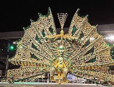 an elaborately decorated display in the shape of a peacock with lights on it's wings