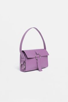 Our bestseller, the SHOULDER BAG in soothing lavender, may potentially become your beloved accessory of this season. 
This bag is ideal for an everyday occasion, with enough room for all your essentials. Purple Rectangular Baguette Bag For Everyday Use, Purple Shoulder Bag With Gold-tone Hardware For Everyday Use, Everyday Lavender Rectangular Shoulder Bag, Purple Shoulder Bag With Gold-tone Hardware And Double Handle, Purple Rectangular Shoulder Bag With Gold-tone Hardware, Modern Purple Rectangular Satchel, Modern Rectangular Purple Satchel, Purple Shoulder Bag With Gold-tone Hardware For Shopping, Purple Top Handle Shoulder Bag With Gold-tone Hardware