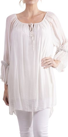 Long, stunning blouse/tunic with front tie and silver detail on sleeve. Can be worn off-shoulder or up. 30% silk, 70% viscose. One Size Fits All. Made in Italy. Spring Silk Off-shoulder Blouse, Off-shoulder Silk Blouse For Spring, Summer Blouse With Sheer Sleeves For Daywear, Long Sleeve Viscose Blouse With Ruffles, Summer Tops With Gathered Sleeves, Flowy Fit, Summer Flowy Blouse With Elastic Sleeves, Summer Flowy Top With Gathered Sleeves, Summer Tops With Gathered Sleeves And Flowy Fit, Spring Bohemian Blouse With Elastic Sleeves