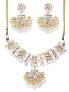 This impressive jewelry set consists of a drop necklace and a pair of chandbali earrings. The crescent-shaped beaded necklace shown in off-white color comes gold-plated with kundan stone studs, and secured with an adjustable drawstring closure. A pair of matching chandbali earrings come secured with a post and back closure. This eye-catching set can add impact to any outfit for any festive occasion! Get ready for compliments! Product color may vary based on the monitor or screen you are using.Se Festival Kundan Chandbali Necklace With Gold Beads, White Necklace With Mirror Work For Festivals, Festival Chandbali Kundan Necklace With Gold Beads, Chandbali Kundan Necklace With Gold Beads For Festivals, Beaded Kundan Chandbali Jewelry Sets, White Necklace With Mirror Work For Festive Season, White Jewelry Sets With Mirror Work For Festivals, Beaded Chandbali Kundan Necklace, White Jewelry Sets With Latkans