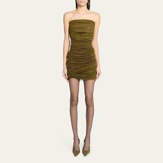 Saint Laurent tulle dress with ruched detail Strapless neckline Sleeveless Body-conscious silhouette Mini length Slipover style Silk Made in Italy Body Conscious, Strapless Neckline, Strapless Mini Dress, Tulle Dress, Bergdorf Goodman, Green Dress, Top Designers, Saint Laurent, Tops Designs