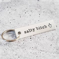 The perfect keyring for the saltiest of us all! Middle Finger Emoji, Finger Emoji, Wine Glassware, 2022 Happy New Year, Bar Keychain, Funny Gifts For Her, Holiday Gift Card, Hand Stamped Keychain, Kraft Boxes