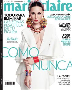 a magazine cover with a woman in a white dress and jewelry on her neckline