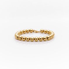 Bold Bead Bracelet - Nashelle Elegant Gold Stretch Bracelet With Large Beads, Classic Stretch Bracelet With Polished Beads, Elegant Bracelets With Gold Round Beads, Classic Bracelet With Spacer Beads, Classic Beaded Round Bracelets, Classic Formal Bracelets With Polished Beads, Elegant Gold Bracelets With Large Beads, Gold Everyday Beaded Bracelet, Everyday Bracelet With Polished Beads