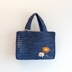 IN STOCK FAST SHIPPING FROM LOS ANGELES Get ready to tote your summer essentials in style with this handmade straw bag! Made from natural raffia, this bag features a charming daisy flower design and a large opening for easy access. The top handles make it a breeze to carry, perfect for a day at the beach or a picnic in the park. It's the ultimate combination of fashion and functionality. (Plus, it's totally handmade, so you know it's special.) Size: 9"H x 13"W x 4"D Designer Style ID: 8629 Bohemian Beach Bag For Everyday Spring Use, Handmade Trendy Bags For Spring, Trendy Handmade Bags For Spring, Trendy Straw Bag For Everyday Spring Use, Rectangular Straw Bag For Spring, Chic Blue Handwoven Straw Bag, Eco-friendly Top Handle Beach Bag For Spring, Blue Handwoven Bags For Spring, Trendy Spring Straw Bag