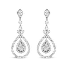 Let the sparkle of diamonds enhance your every look! Glimmering prong-set round diamonds adorn polished 18k white gold, giving you a stunning look of sophistication. These diamonds total 1 1/4 cttw with an approximate F-G Color and VS1-VS2 Clarity. The silhouette features an intricate upper dangle set with diamonds clusters above a single round diamond encases in a secure bezel setting with milgrain detail. Beginning the lower dangle is a trio of round white diamonds that signify the past, present, and future, which are also showcases in bezel settings with milgrain ornamentation. A cluster of round, prong-set diamonds form a teardrop silhouette haloed by additional round, prong-set diamonds. A metal framework prong-set with round diamonds adds a second halo to this centerpiece that captur Classic White Gold Diamond Chandelier Earrings, Brilliant Cut Diamond Drop Earrings, Platinum Pear-shaped Diamond Earrings With Accents, Classic Diamond Chandelier Earrings With Brilliant Cut, Classic Diamond Chandelier Earrings With Diamond Accents, White Gold Teardrop Chandelier Earrings With Diamond Accents, Platinum Diamond Drop Earrings With Pave Setting, Diamond White Sparkling Chandelier Earrings, Diamond Chandelier Earrings With Brilliant Cut For Anniversary