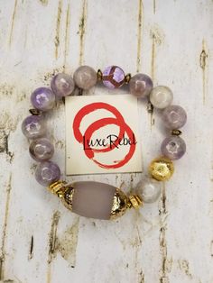 Electroplated Amethyst gemstone bracelet with  w/ textured gemstone gold tip barrel focal bead Bottom Gold Amethyst Bracelets For Healing, Elegant Gemstone Beads Stretch Bracelet For Meditation, Adjustable Beaded Bracelets With Gemstone Accents, Adjustable Spiritual Beaded Bracelets With Gemstone Accents, Gold Agate Gemstone Beaded Bracelet, Gold Agate Gemstone Beaded Bracelets, Gold Agate Beaded Bracelets With Gemstones, Elegant Amethyst Stretch Bracelet With Natural Stones, Elegant Amethyst Rondelle Beaded Bracelets