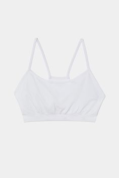 An easy to wear seamless bra designed to go from gym to everyday...seamlessly. Chafe-free fabric lets you move with easy and layers beautifully under any top. BEST FOR: running, yoga, crossfit, barre, pilates, spin class or gym workouts. Model is 5'10" and wears a size XS/S. Functional Crop Top With Built-in Bra For Pilates, Micro-elastic Seamless Tops With Built-in Bra, Seamless Micro-elastic Sports Bra For Pilates, Cotton Seamless Crop Top For Workout, White Activewear With Built-in Bra For Everyday, Workout Seamless Cotton Crop Top, Solid Color Crop Top With Light Support For Exercise, Sports Tops With Built-in Bra And Minimal Stretch, Crop Top With Light Support For Exercise