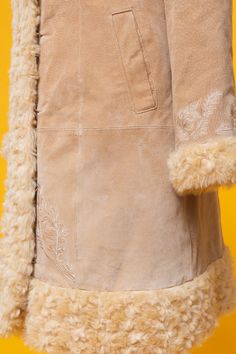 "Follow our Instagram for updates @fantasia_superstar FB: https://www.facebook.com/fantasiasuperstar We're open to reasonable offers ♡ Amazing 60s 70s inspired beige suede leather & faux fur coat ⫸ Super rare and beautiful ❀ Penny Lane ❀ It's really gorgeous!! ⫸ Condition: Beautiful vintage pre-loved condition. Without any odors. Some teeny-tiny marks on the leather but REALLY nothing noticeable. Please see the pictures <3 ⫸ Lined with soft silky polyester ⫸ Amazing floral embroidery on f Beige Winter Outerwear For Festivals, Fitted Beige Outerwear For Festivals, We're Open, Beige Coat, Penny Lane, Dec 30, Almost Famous, 70s Inspired, Faux Fur Coat