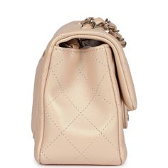 This Chanel mini classic rectangular flap bag is of iridescent beige lambskin leather with light gold tone hardware and has a front flap with signature CC turnlock closure, rear half moon pocket, single interwoven iridescent beige leather and light gold chain link shoulder/crossbody strap.The interior is lined in iridescent beige leather and features a zipper pocket with Chanel pull and an open pocket below.Collection: 22C (RFID Chip)Origin: FranceCondition: New and never worn (plastic on hardware)Accompanied by: Chanel box (damaged), Chanel dustbag, felt and COA cardMeasurements: 8" width x 5" height x 2.5" depth; 20" strap drop Chanel Mini Rectangular, Chanel Box, Hermes Birkin 25, Mini Classic, Chanel Mini, Celine Bags, Fendi Bags, Exclusive Bag, Flap Bag