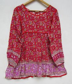 "ITEM DESCRIPTION pink red floral printed rayon bohemian women blouse and tops - boat neckline with back tassel blouse - long sleeve summer blouse and tops Features : Long sleeve, boat neck, Blouse Material : rayon crepe Fabric: 100% rayon soft light weight ethnic print fabrics Sleeve Length = 22 inch For more sizes & their measurement, please refer our below chart to understand the sizes variations available with us For your size requirement, please mention your size in seller note at the t Red Long Sleeve Beach Blouse, Red Long Sleeve Blouse For Summer, Long Sleeve Printed Peasant Top For Vacation, Bohemian Long Sleeve Rayon Blouse, Long Sleeve Boho Print Peasant Top For Beach, Long Sleeve Bohemian Rayon Blouse, Beach Long Sleeve Peasant Top With Boho Print, Long Sleeve Boho Peasant Top For Beach, Red Long Sleeve Blouse For Vacation