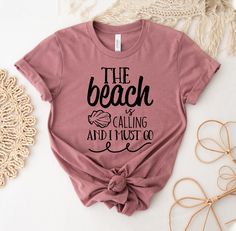 "The Beach Is Calling And I Must Go T-shirt, Beach Summer Shirt, Girls Weekend Tee,  Summer Vacation Top, Beach Matching Gift, Beach Tee, Family Vacation Tshirt, Summer Lover Shirt, Beach Summer Shirt, Summer Shirt, Beach Party Shirt, Summer Lover Shirt, The Beach Is Calling, And I Must Go, Family Vacation, Vacation Shirt, Beach Vibes Shirt, Beach Shirt, Girls Trip, Friends Vacation, Holiday Shirt This updated unisex essential fits like a well-loved favorite. Super soft cotton and excellent quality print makes one to fall in love with it over and over again. ------------- Fabrication ------------- 100% Combed ring spun cotton Made by specially treating the cotton fibers before spinning them into yarn. The result is stronger and smoother fabric. ------------- Unisex T-shirt Size Chart ----- Beach Holiday Cotton T-shirt, Beach Season Holiday Cotton T-shirt, Holiday Beach Tops With Letter Print, Letter Print Tops For Beach Holiday, Cotton T-shirt For Beach Holiday, Letter Print T-shirt For Beach Season Holiday, Tequila Made Me Do It, Trip Friends, Party Shirts Men