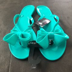 Brand New Teal Bow Sandals Size 7/8 Turquoise Open Toe Sandals For Summer, Turquoise Synthetic Sandals For Spring, Blue Flat Jelly Sandals For Summer, Turquoise Open Toe Flip Flops For Spring, Blue Jelly Sandals For Spring Party, Blue Synthetic Jelly Sandals For Summer, Turquoise Flip Flops For Beach In Spring, Turquoise Sandals For Summer Beach Season, Turquoise Sandals For Summer Beach