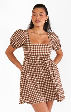 You'll be just smitten in this brown gingham babydoll dress! A cool square neckline next to perfectly poofy sleeves are contrasted to flatter a range of bust sizes and the elastic smocking in the back allows for a perfect fit! Girly Manifestation, Fall Clothing Essentials, Maternity Dress Outfits, Poofy Sleeves, Brown Gingham, Fall Family Photo Outfits, Boho Maternity, Cross Country Road Trip, Wishlist Clothes