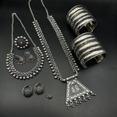 Adjustable Silver Jewelry With Motifs, Traditional Jewelry Sets With Latkans, Navratri Themed Motif Jewelry Gift, Traditional Silver Sets As Gift, Traditional Silver Sets For Navratri, Traditional Silver Sets For Gifts, Bohemian Jewelry Sets With Intricate Design, Traditional Adjustable Silver Jewelry Sets, Silver Heavy Sets For Diwali