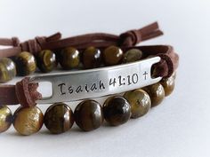 "Wear your favorite inspirational words on your wrist to remind yourself of what matters most to you every day. :) This unisex bracelet features the bible verse \"Isaiah 41:10\", hand stamped into non tarnish stainless steel, with a small cross at the end of the verse. The soft brown faux suede leather cord is adjustable and fits most wrist sizes. You can choose any other short verse you would like under \"personalization\", up to 10 letters works best with this design, but I can squeeze up to 1 Bible Verse Isaiah, Verse Bracelet, Life Verse, Bible Verse Bracelet, Boho Wrap Bracelet, Medical Bracelet, Leather Bar, Bar Bracelet, Boho Leather