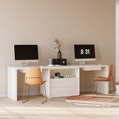 two computer monitors sitting on top of a white desk next to each other in a room