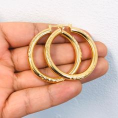 Material: 14k Gold Filled Measurements: 1.8x1.6 Inches Thickness: 5mm Gold Jewelry With Shiny Finish For Anniversary, Hallmarked Gold-plated Yellow Jewelry, Gold Jewelry With Shiny Finish For Wedding, Gold Jewelry With Shiny Finish, Gold Round Jewelry With Shiny Finish, Gold 14k Stamped Hoop Earrings As Gift, Gold Hoop Earrings Stamped 14k For Wedding, Gold Hoop Earrings Stamped 14k As Gift, Gold Hoop Earrings Stamped 14k For Gift