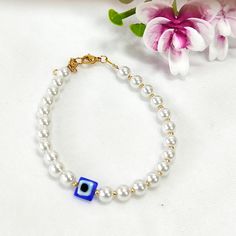 Evil eye pearl beaded bracelet, Protection bracelet, Pearl bracelet, Pearl purple beadedbracelet, Gift for her, Mother's day gift Pretty delicate handmade bracelet with glass pearls and glass blue square evil eye bead Steel closure and chain Simple, modern and trendy design. It has extension steel chain to fit any size This is a great bracelet for everyday wear as well as special occasions! All pieces of jewelry are beautifully packaged, ready to be gifted. If you order multiple items, please me Evil Eye Pearl Jewelry As A Gift, Pearl Evil Eye Jewelry For Gifts, Pearl Evil Eye Jewelry As Gift, Pearl Jewelry With Evil Eye Detail As Gift, Pearl Jewelry With Evil Eye As A Gift, Pearl Bracelets With Spacer Beads For Gifts, Elegant Beaded Evil Eye Bracelet Gift, Beaded Bracelet With Pearl Charm As Gift, Gift Beaded Bracelet With Pearl Charm