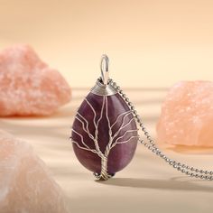 PLEASE NOTE: Our crystal stones are natural minerals and each crystal is unique. The internal ice cracks, pits, mineral points, and color differences of natural crystals are all formed naturally and are normal phenomena, which will not affect the efficacy, beauty and value of the crystal at all.This necklace is probably the most beautiful piece of jewelry you'll ever see. The intricate tree design weaved around the gorgeous purple crystal adds to this necklace's charm. Wear this magical piece ar Unique Natural Stones Crystals For Gifts, Unique Natural Stones Crystals As Gifts, Spiritual Agate Crystals For Gifts, Spiritual Agate Crystals As Gift, Lavender Spiritual Crystals For Gift, Spiritual Lavender Crystals For Gifts, Natural Stone Crystal Pendant, Natural Stone Pendant Crystal, Purple Mineral Crystal For Jewelry Making