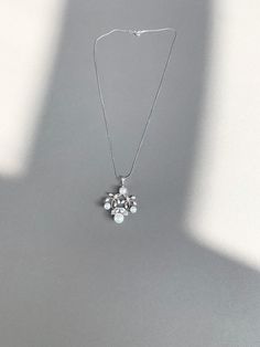 "This delicate floral pendant is hand made using Premium Quality European Crystal and fine quality cultured freshwater pearls. Available in gold, rose gold or silver finish.  The pendant measures 1 3/4\" long and 1 1/4\" wide. The necklace is 18\" long. For the matching earrings please take a look here: https://www.etsy.com/listing/684400559/bridal-pearl-earrings-crystal-and?click_key=e783273204a3125b36345a6867ca87f500487c95%3A684400559&click_sum=f5090d17&ref=shop_home_active_66&frs=1 https://ww White Gold Pendant Bridal Necklace Gift, White Gold Dangle Pearl Pendant Jewelry, White Gold Dangle Pearl Pendant, Diamond White Flower Pendant Necklace For Wedding, Elegant White Flower Pendant Jewelry, Elegant Pearl Necklace With Flower Pendant Gift, White Pearl Drop Flower Pendant Necklace, Silver Pearl Necklace With Round Pendant For Wedding, Diamond White Pendant Pearl Necklace As Gift