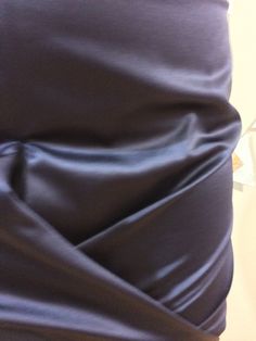 This gorgeous deep purple satin skirt is a piece of art. The fabric is like butter and the zipper on the rear fits perfectly on your curves. We love the gathering at the front to show off your figure. You'll feel like you can take on the world in this sexy skirt. Skirt features logo embossed zipper. Designer: Burberry Size: 6 30" waist 35" hips 19" front 23" back Material Outer: 58% Polyester, 47% Cotton Lining: 100% Cupro Care: Dry Clean or Hand wash Wash, line dry, and steam Condition: Like New (Condition Guide) Retail $1159 Product From Canada, Made in Italy ♥ Sustainable + Ethical Satin Skirt With Ruched Detail For Night Out, Satin Ruched Skirt For Night Out, Ruched Satin Skirt For Night Out, Fitted Draped Satin Skirt, Elegant Draped Stretch Skirt, Purple Satin Party Skirt, Purple Satin Skirt For Party, Evening Satin Skirt With Stretch, Stretch Satin Skirt For Evening