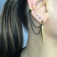 Simple yet edgy Spike earrings and cuff are made of 316L Stainless steel . Can be purchased as single or a pair. Spike earrings 1 3/4 inches long Cuff is 6mm wide Short chain 1 3/4 inches All items are shipped in a gift box Punk Metal Cartilage Earrings, Pierced Drop Cartilage Earrings For Party, Trendy Metal Stud Jewelry, Party Drop Cartilage Earrings, Punk Style Pierced Dangle Cartilage Earrings, Punk Style Metal Cartilage Earrings For Party, Black Metal Stud Jewelry, Gold Dangle Punk Jewelry, Punk Metal Ear Cuff For Party