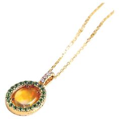 Beautiful Flame Two Side Mexican Fire Opal, Diamond, Pink Sapphire, Tsavorite, Necklace 18K Yellow Gold. Free Domestic USPS First Class Shipping! Free Gift Bag or Box with every order! Opal—the queen of gemstones, is one of the most beautiful gemstones in the world. Every piece of opal is unique in its own ways and patterns. We only use high-quality Natural Opals (NO synthetics or imitations) for our jewelry. --------------------------------------------------------------------------------------- Unique Yellow Gold Opal Necklaces, Luxury Yellow Gold Opal Necklace, Opal Cabochon Yellow Gold Jewelry, Yellow Gold Opal Cabochon Jewelry, Mexican Fire Opal Necklace, Opal Color, Natural Opal, Pink Sapphire, Fire Opal