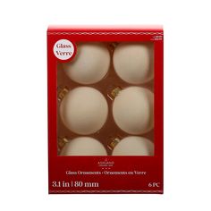 six white glass christmas ornaments in a red box