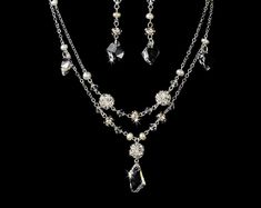 "Stylish and elegant, this silver or gold plated necklace and earring set is the perfect accessory for your wedding, honeymoon or special occasion. The set features freshwater pearls and clear Swarovski crystals, the perfect finishing touch to your vintage chic or classic wedding dress. READY TO SHIP DETAILS: - Necklace: 15\" long with a 2.5\" adjustable extender, Earrings: 1.5\" long. - Earrings - 2\" (Length) - Offered in Gold or Silver COORDINATING SASHES, CUFF BRACELETS & FASCINATORS, VI Silver Jewelry Sets With Pearl Drop For Formal Occasions, Silver Crystal Jewelry Set With Pearl Drop, Gold Sterling Silver Jewelry Sets For Wedding, Elegant Silver Dangle Jewelry Sets, Crystal Pearl Drop Jewelry For Mother Of The Bride, Silver Crystal Jewelry With Pearl Drop, Silver Dangle Jewelry Sets For Anniversary, Wedding Costume Jewelry Necklaces With Sparkling Stones, Silver Bridal Necklace With Pearl Drop For Anniversary